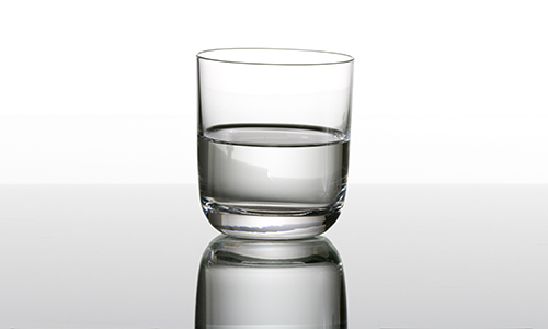 A glass of water that is half filled or half empty.